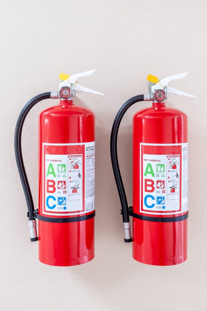 Fire extinguisher system on the wall background,